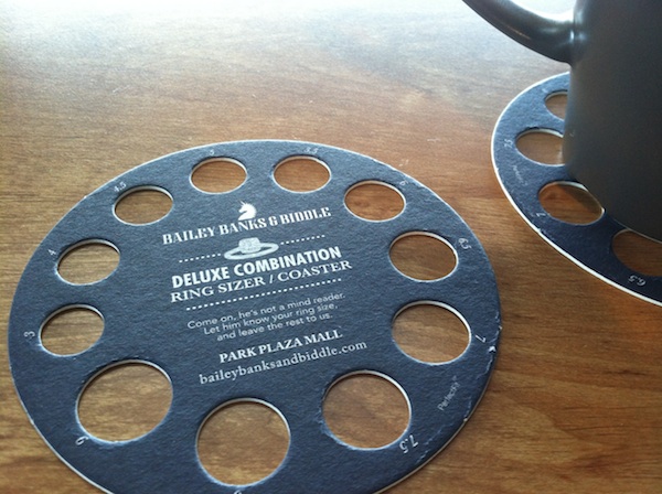 Bailey Banks & Biddle made a coaster into a ring sizer to get more word of mouth out of their swag. 